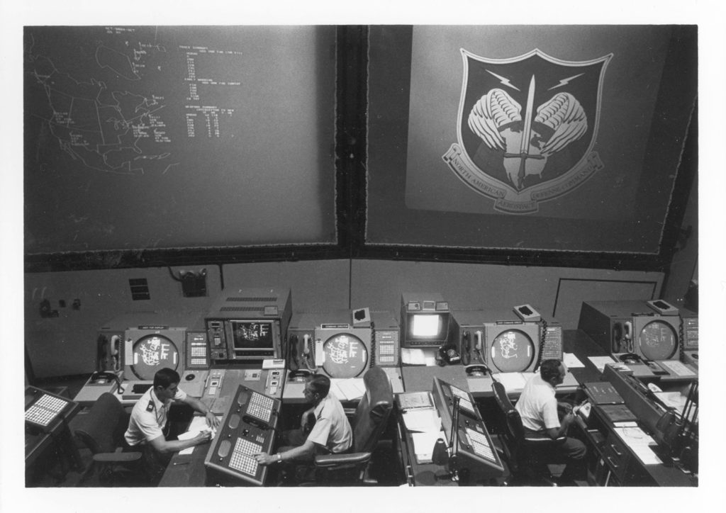 "Command post for all NORAD [North American Aerospace Defense Command] operations, including the Command's surveillance and warning sensors around the globe." Caption from U.S. Information Agency photo. This and the next two photos were taken about 1982 so the depiction of NORAD facilities may not correspond exactly to arrangements during 1979-1980.

Source: National Archives, Still Pictures Branch, RG 306-PSE, box 79